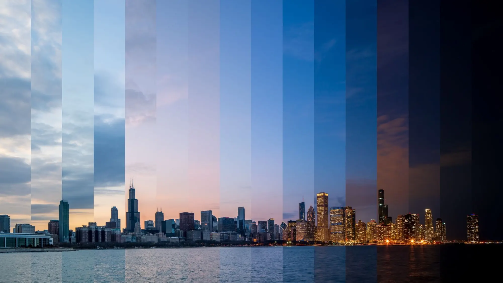 Chicago skyline over Lake Michigan from day to night